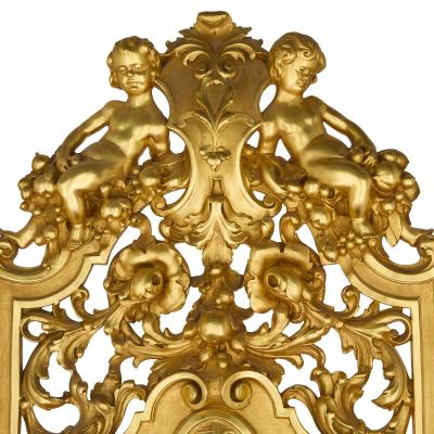 Set of four Baroque style carved giltwood and velvet throne armchairs