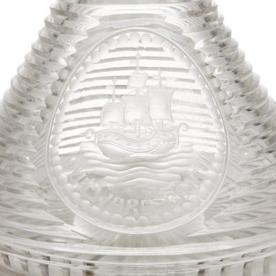 Set of four English engraved and cut glass ships decanters