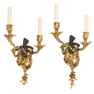 Set of four Rococo style patinated and gilt bronze sconces