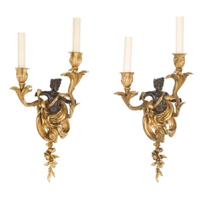 Set of four Rococo style patinated and gilt bronze sconces