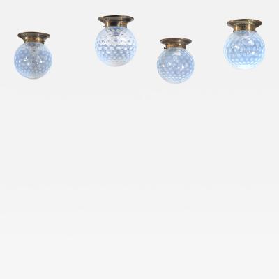 Set of four glass and brass ceiling lamps