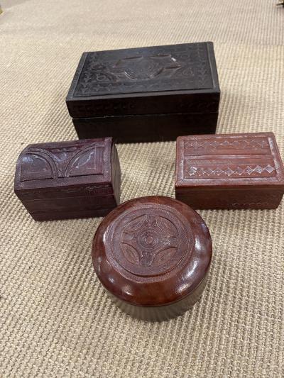 Set of four hand made leather boxes