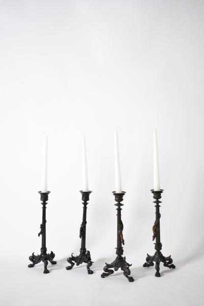 Set of four tripod zoomorphic bronze candleholders XIXth c 