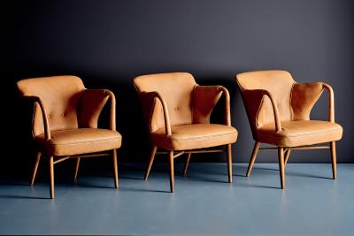 Set of three elegant Lounge Chairs upholstered in cognac Aniline Leather