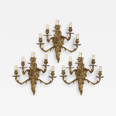 Set of three gilt bronze sconces in the Baroque style