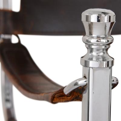 Set of two Mid Century Modern silvered and leather chairs