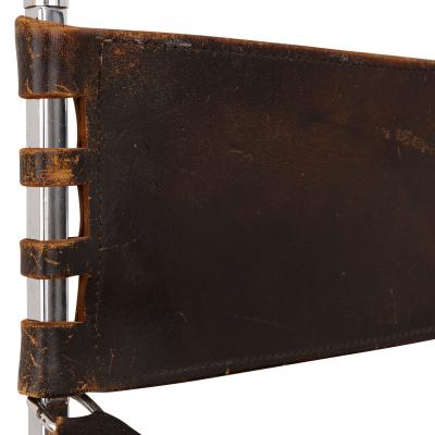 Set of two Mid Century Modern silvered and leather chairs