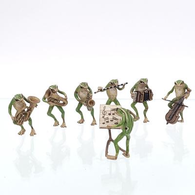 Seven cold painted bronze Musical Frogs