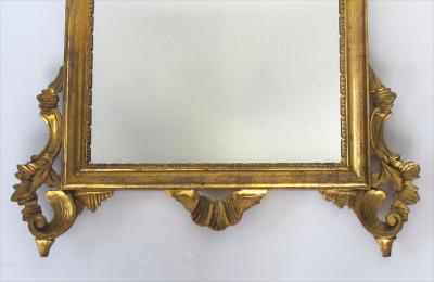 Shapely Italian rococo style carved giltwood mirror with openwork rocaille crest