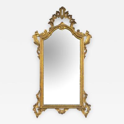 Shapely Italian rococo style carved giltwood mirror with openwork rocaille crest