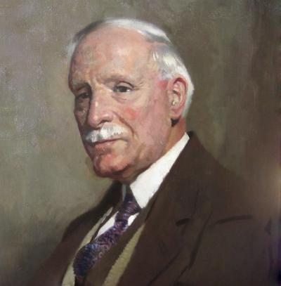 Sir William Orpen Portrait of Thomas Glass Seated Half Length in a Brown Three Piece Suit