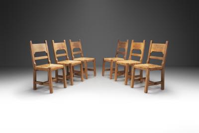 Six Brutalist Dining Chairs with Rush Seats Europe ca 1960s