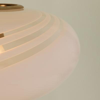 Small oval shaped 1960s Italian white pendant with decorative swirl