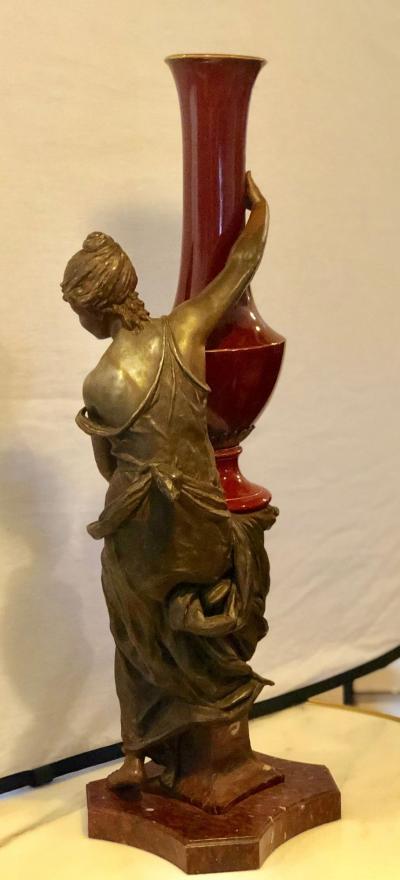 Spelter Figure of a Water Bearer on a Pedestal Marble with Red Glazed Vase