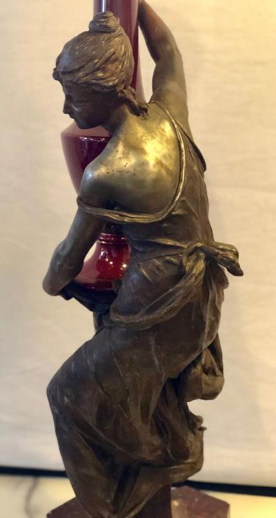 Spelter Figure of a Water Bearer on a Pedestal Marble with Red Glazed Vase