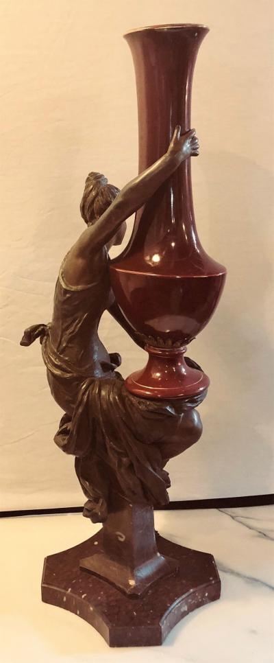 Spelter Figure of a Water Bearer on a Pedestal Marble with Red Glazed Vase