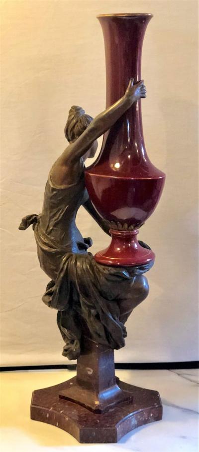 Spelter Figure of a Water Bearer on a Pedestal Marble with Red Glazed Vase