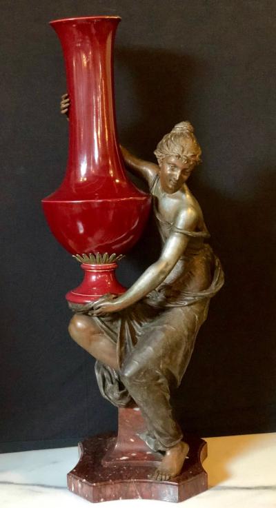 Spelter Figure of a Water Bearer on a Pedestal Marble with Red Glazed Vase