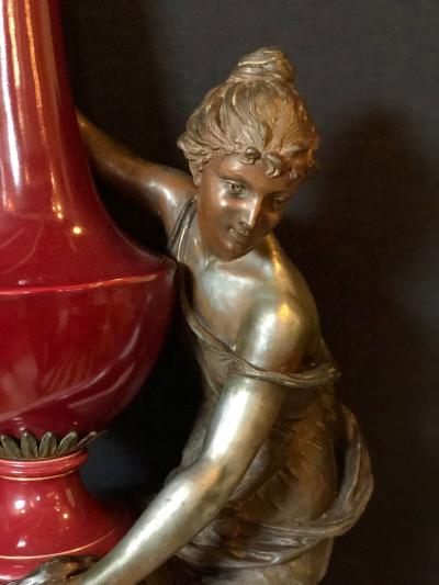 Spelter Figure of a Water Bearer on a Pedestal Marble with Red Glazed Vase