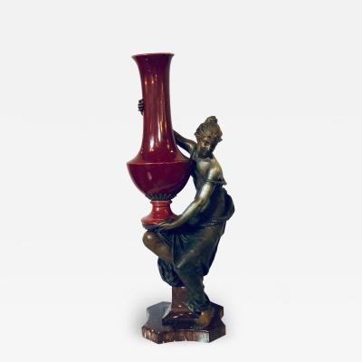 Spelter Figure of a Water Bearer on a Pedestal Marble with Red Glazed Vase