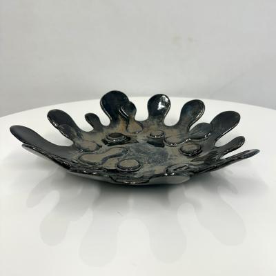 Spudnic Shaped Decorative Bowl in a refective black chrome finish 