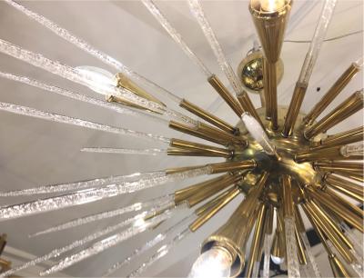 Sputnik chandelier in polished brass and glass Italy 1980