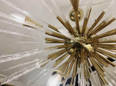Sputnik chandelier in polished brass and glass Italy 1980