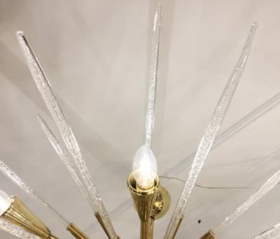Sputnik chandelier in polished brass and glass Italy 1980