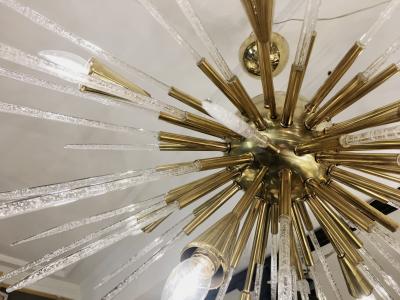 Sputnik chandelier in polished brass and glass Italy 1980