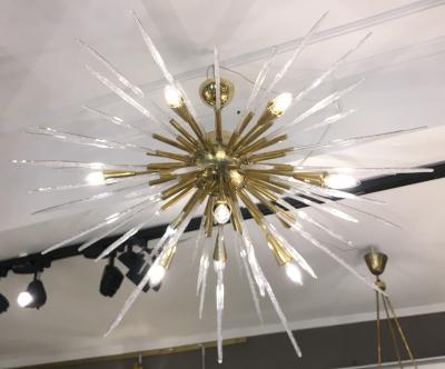 Sputnik chandelier in polished brass and glass Italy 1980