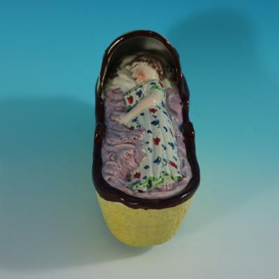 Staffordshire Pearlware Child In Rocking Cradle