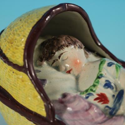 Staffordshire Pearlware Child In Rocking Cradle