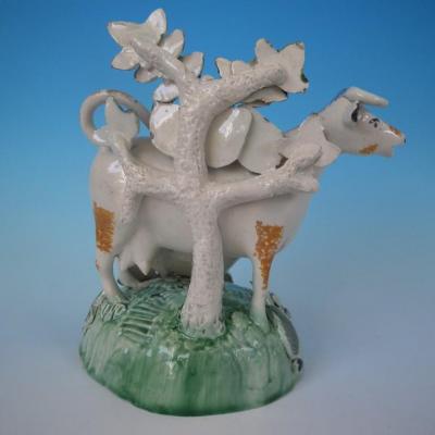 Staffordshire Prattware cow calf creamer with bocage