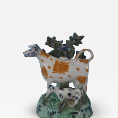 Staffordshire Prattware cow calf creamer with bocage