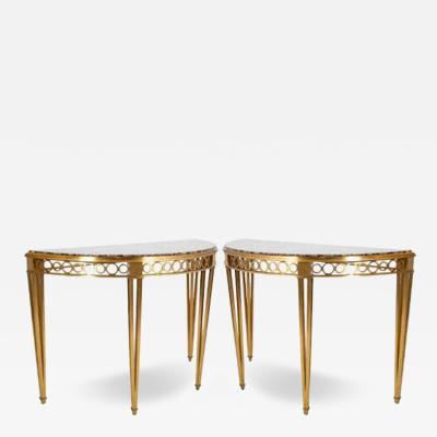 Striking Pair of Bronze Consoles with Fossilized Marble Tops