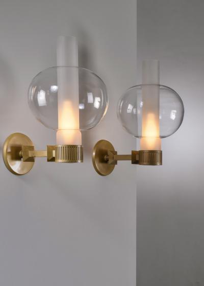Sven Wran r Pair of bronzed metal and glass wall lamps