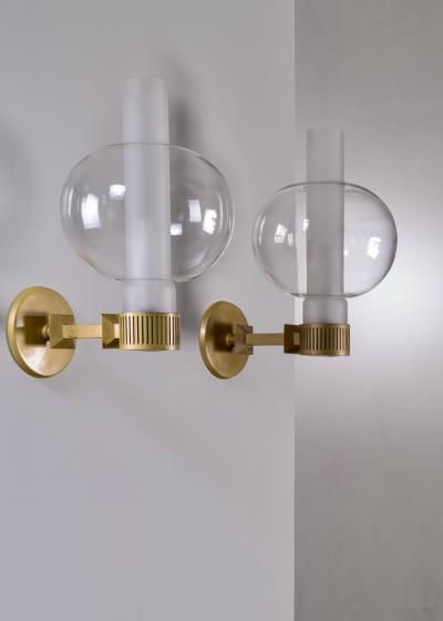Sven Wran r Pair of bronzed metal and glass wall lamps