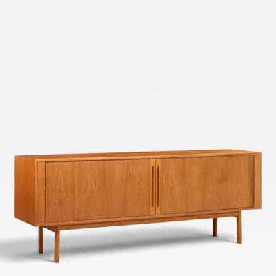 Svend Aage Larsen Svend Aage Larsen for Faarup M belfabrik Danish Teak Tambour Door Credenza