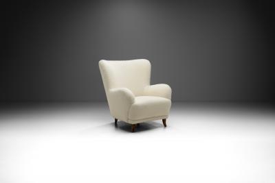 Swedish Cabinetmaker Wingback Chair with Stained Wood Legs Sweden ca 1940s