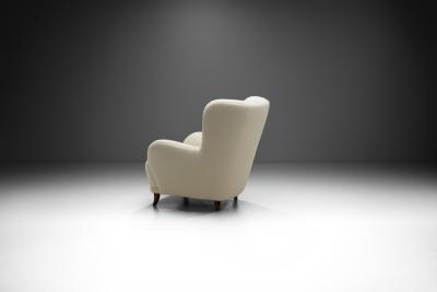 Swedish Cabinetmaker Wingback Chair with Stained Wood Legs Sweden ca 1940s