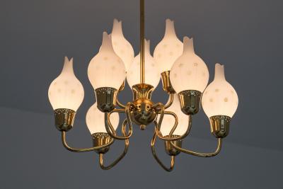 Swedish Modern Nine Arm Chandelier in Brass and Decorated Opal Glass 1950s