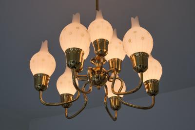 Swedish Modern Nine Arm Chandelier in Brass and Decorated Opal Glass 1950s