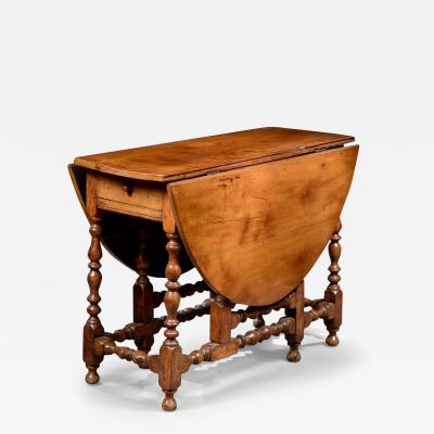 THE CLUETT FAMILY RARE EARLY GATELEG TABLE