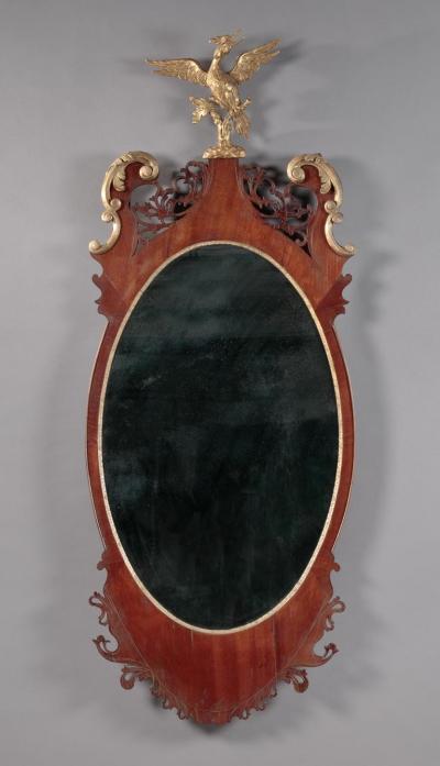 THE HAZZARD FAMILY OVAL CHIPPENDALE LOOKING GLASS