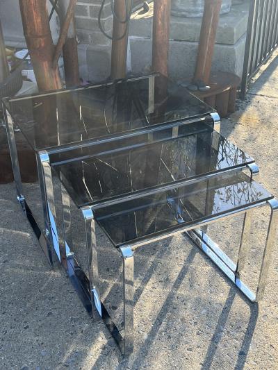 TRIO OF MODERN ITALIAN CHROME BAND AND SMOKY GLASS NESTING TABLES