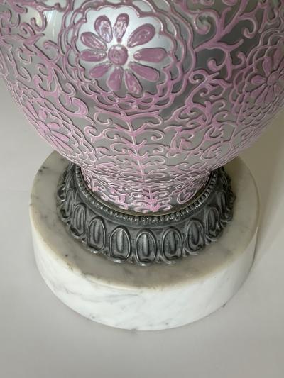 Tall pair of reverse silvered lamps with applied floral vine decoration