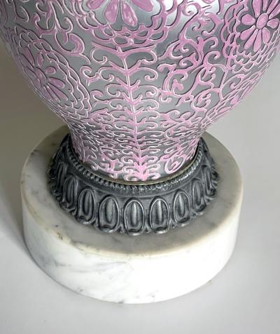 Tall pair of reverse silvered lamps with applied floral vine decoration