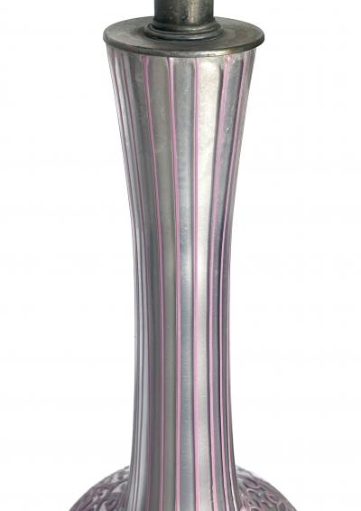 Tall pair of reverse silvered lamps with applied floral vine decoration