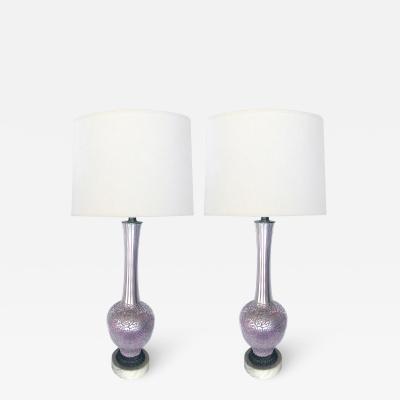 Tall pair of reverse silvered lamps with applied floral vine decoration