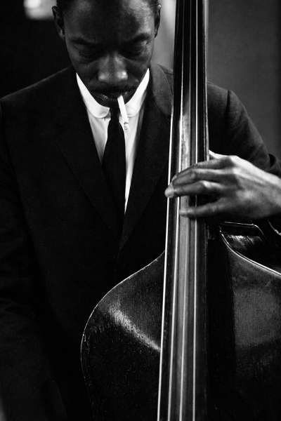 Ted Williams Sam Jones playing the double bass smoking a cigarette